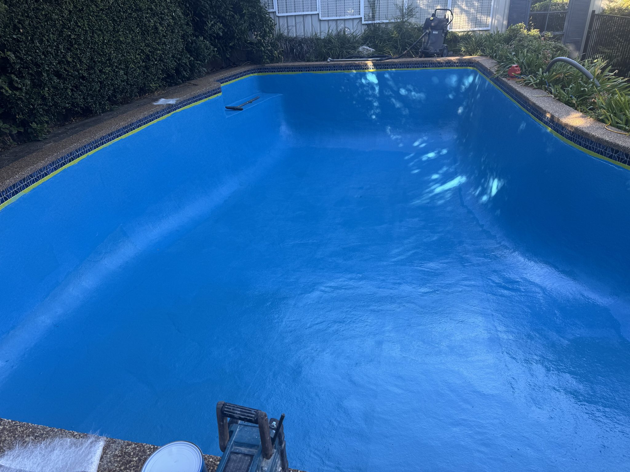 The same pool resurfaced in a deep glossy blue