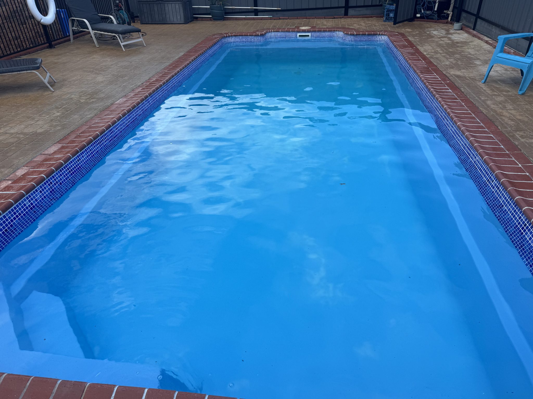 Finished fibreglass pool refilled with fresh blue water