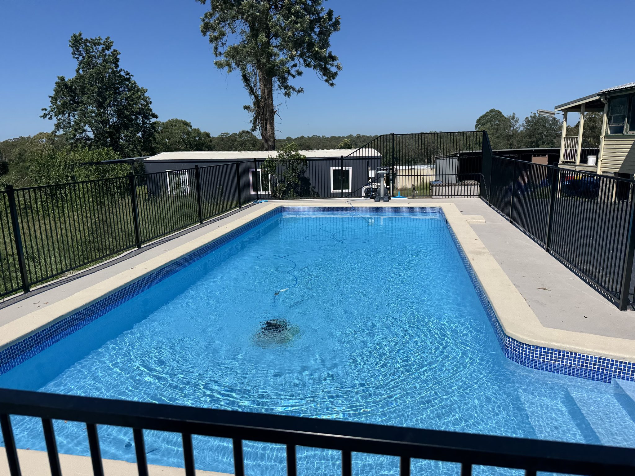The same large pool resurfaced and refilled with clean blue water