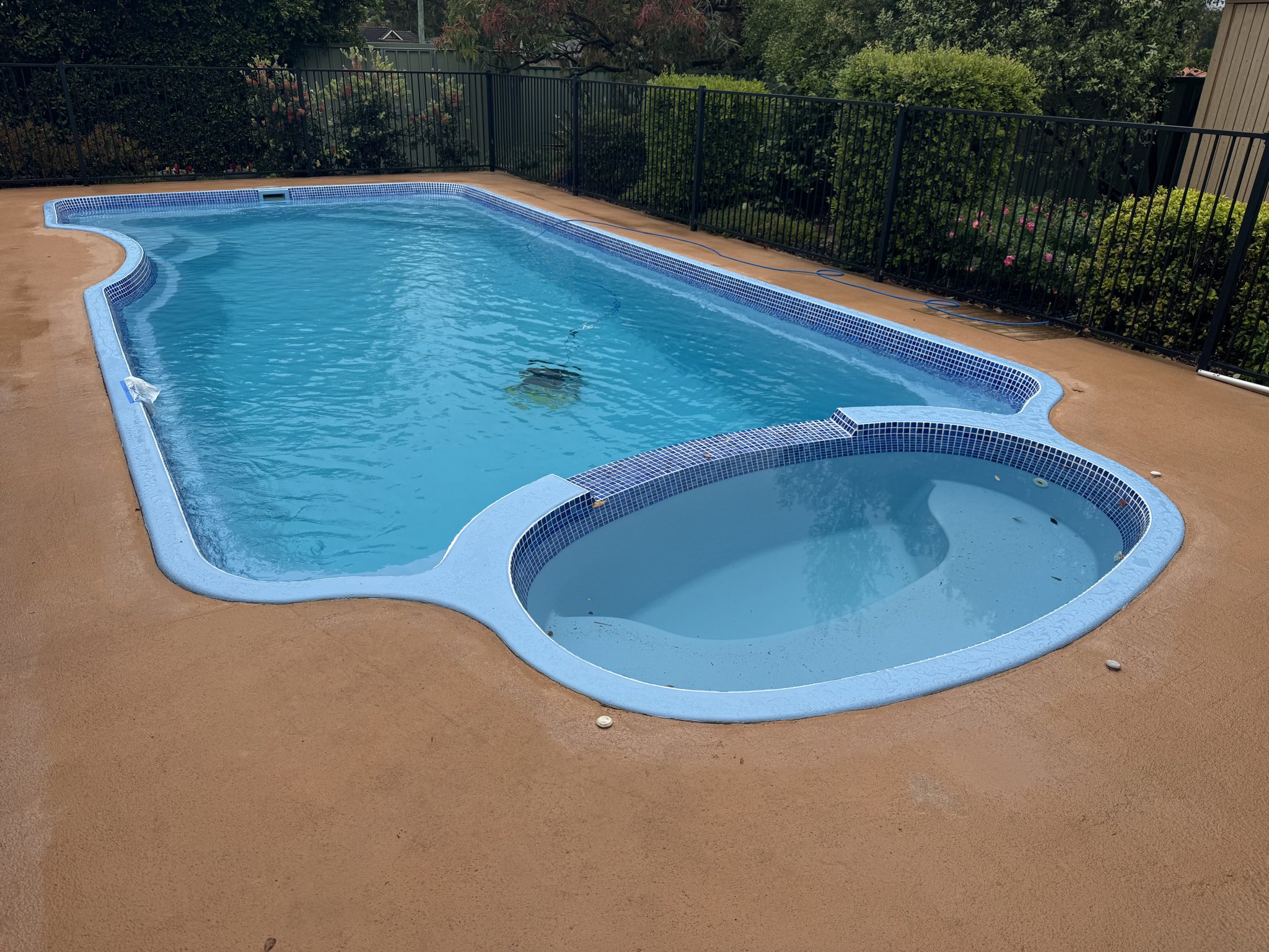 Renovated roman-end pool and spa filled and ready to swim