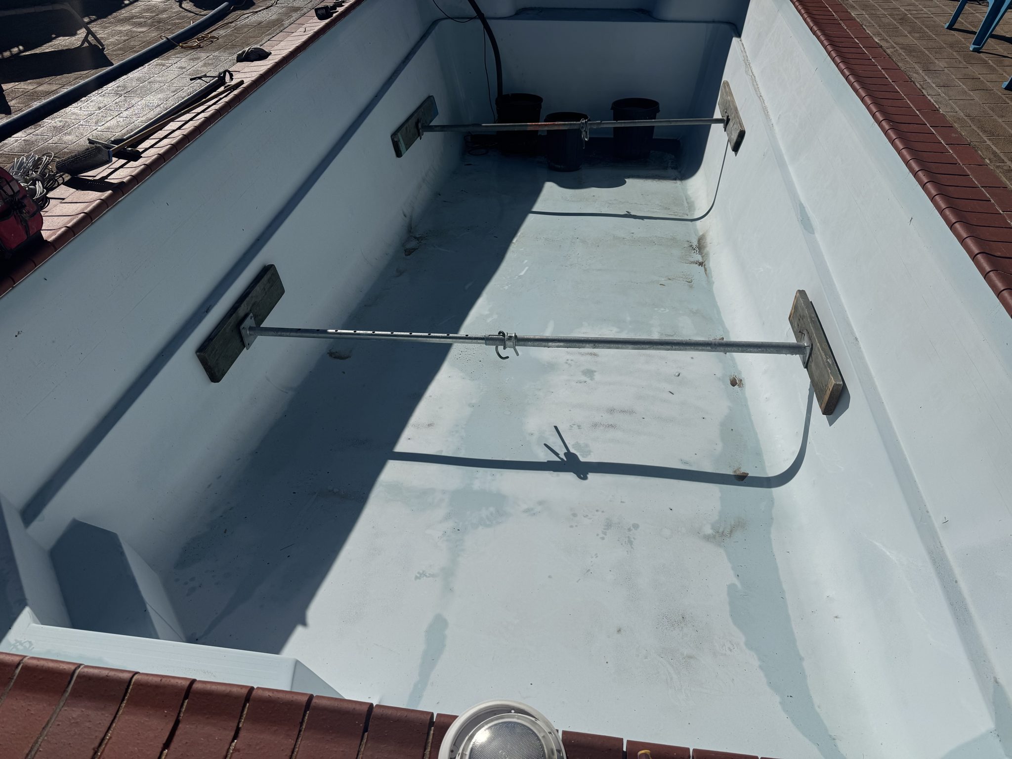 Tired old pool drained and braced before renovation