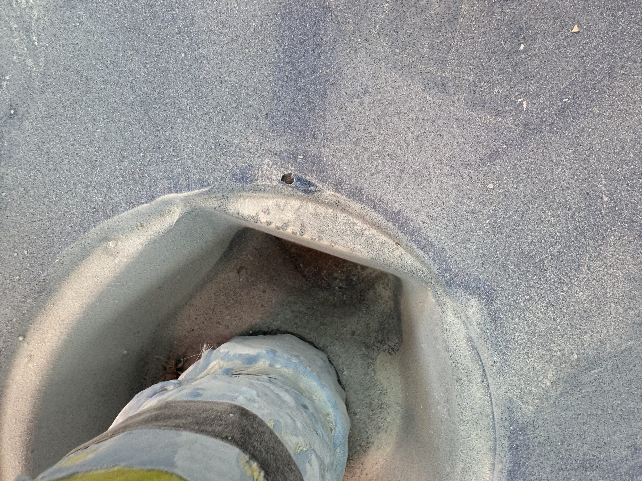 Sealing and reglassing a through-wall pipe fitting
